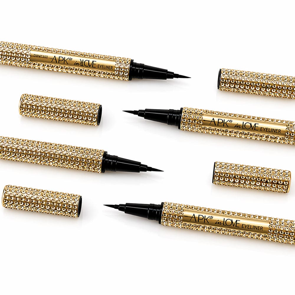 Gold eyeliner pencils with rhinestone accents on a white background victoriastore.com.pk